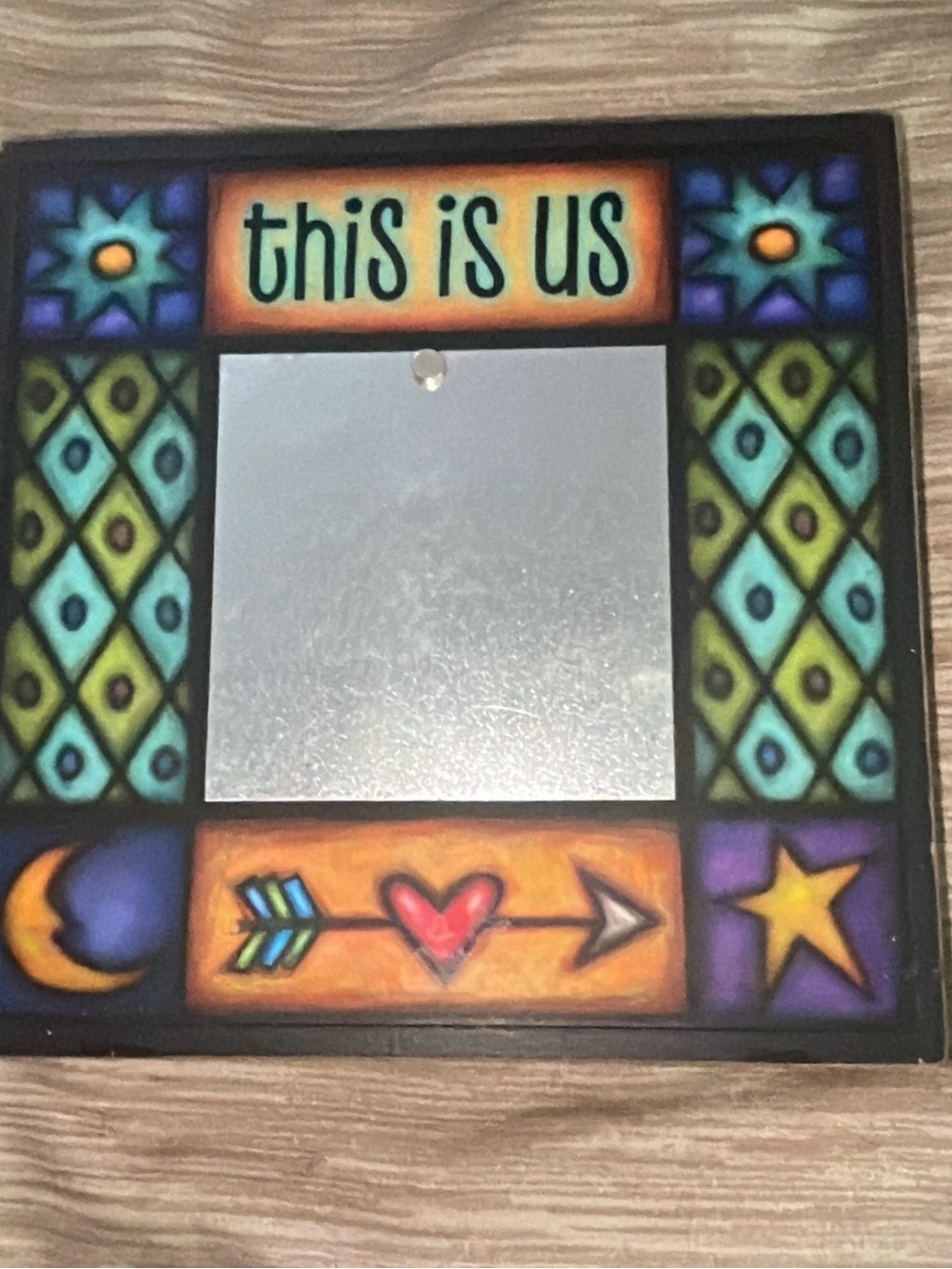 Decorative 'This Is Us' Multicolor Wall Mirror by Michael Macone